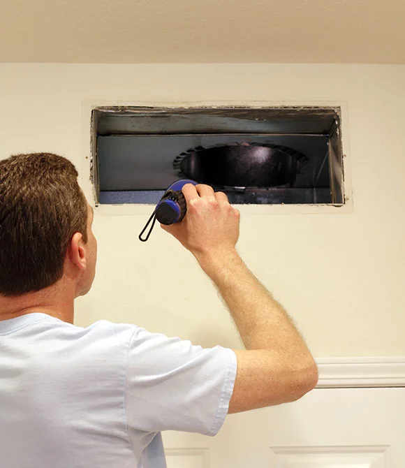 Expert from Anderson Air Duct Cleaning performing Services