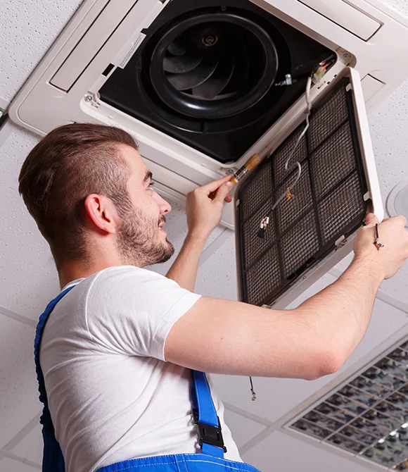 An expert setting the air vent after performing Air duct cleaning services in Cape Cod